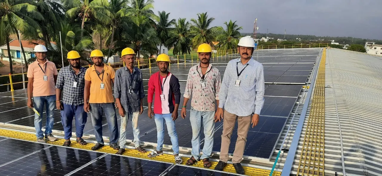 Suntec installation team on a completed rooftop solar plant